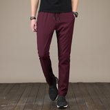 New Men's Casual Pants Autumn Winter Designer Solid Color Plus Size Slim Stretch Pants Men Loose Sweat Pants M~5XL AFK01
