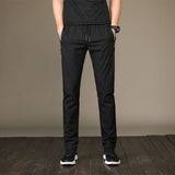 New Men's Casual Pants Autumn Winter Designer Solid Color Plus Size Slim Stretch Pants Men Loose Sweat Pants M~5XL AFK01